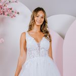 A-line gown with Sweet lace blossoms and trailing vines covering the bodice
