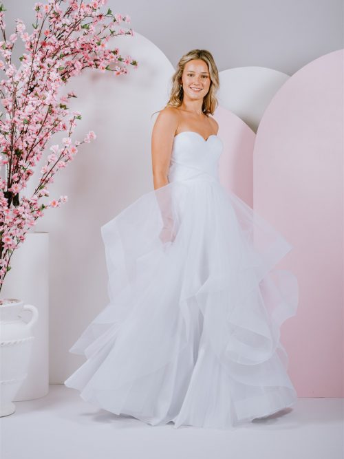 strapless sweetheart neckline ballgown with All frills and ruffles and a full tulle skirt