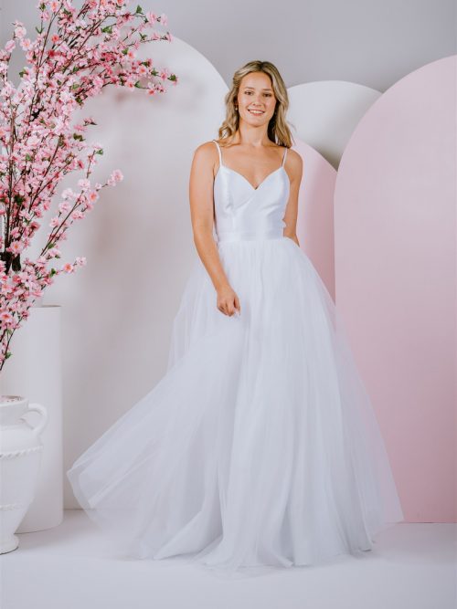 Fun featured bow on the back with tulle skirt and straps ballgown