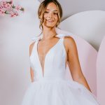 silhouette gown with sweet bows on the shoulder and deep v neckline with tulle skirt