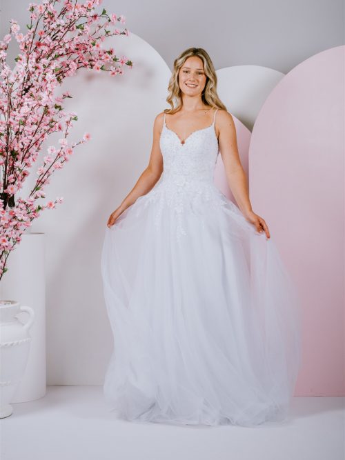 Gown features a stunning sweetheart neckline with a sheer back and boning detail