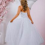Gown with a sequined strapless style with a straight neckline and sheer back with a lace-up finish