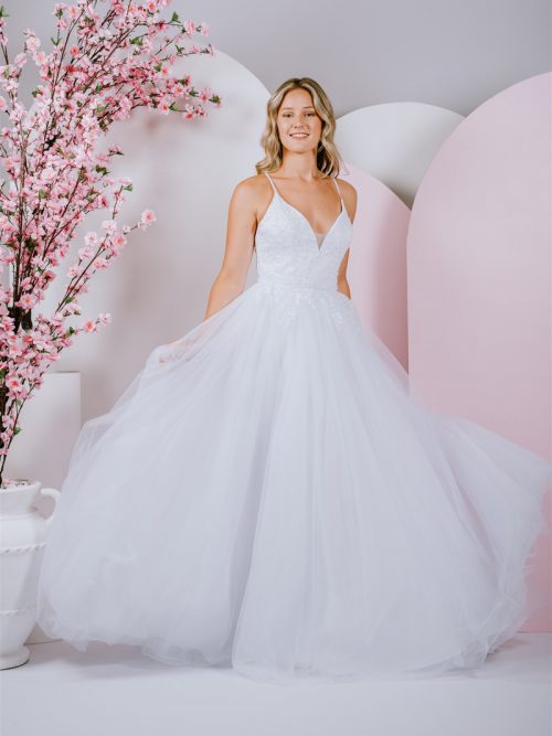 shimmering ballgown features a modern tie back and delicate beaded lace