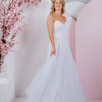 elegant gown, featuring a pleated tulle bodice and soft A-line skirt