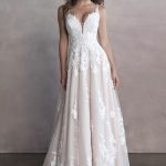 9811 Allure Bridals gown gives the illusion of falling blooms and leaves scattered along the aisle