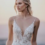 A1167 Allure Bridals curve-hugging sequined lace appliques, trail along the bodice of this A-line gown